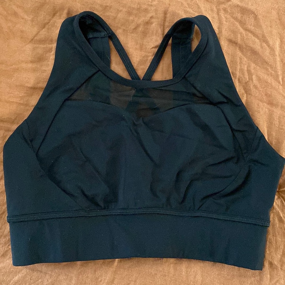 High neck line sports bra, sheer mesh on the front, super straps back! Size 6!